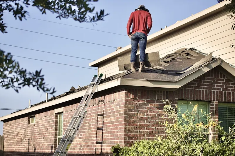 Professional roofer working on a residential roof in Hunt Valley